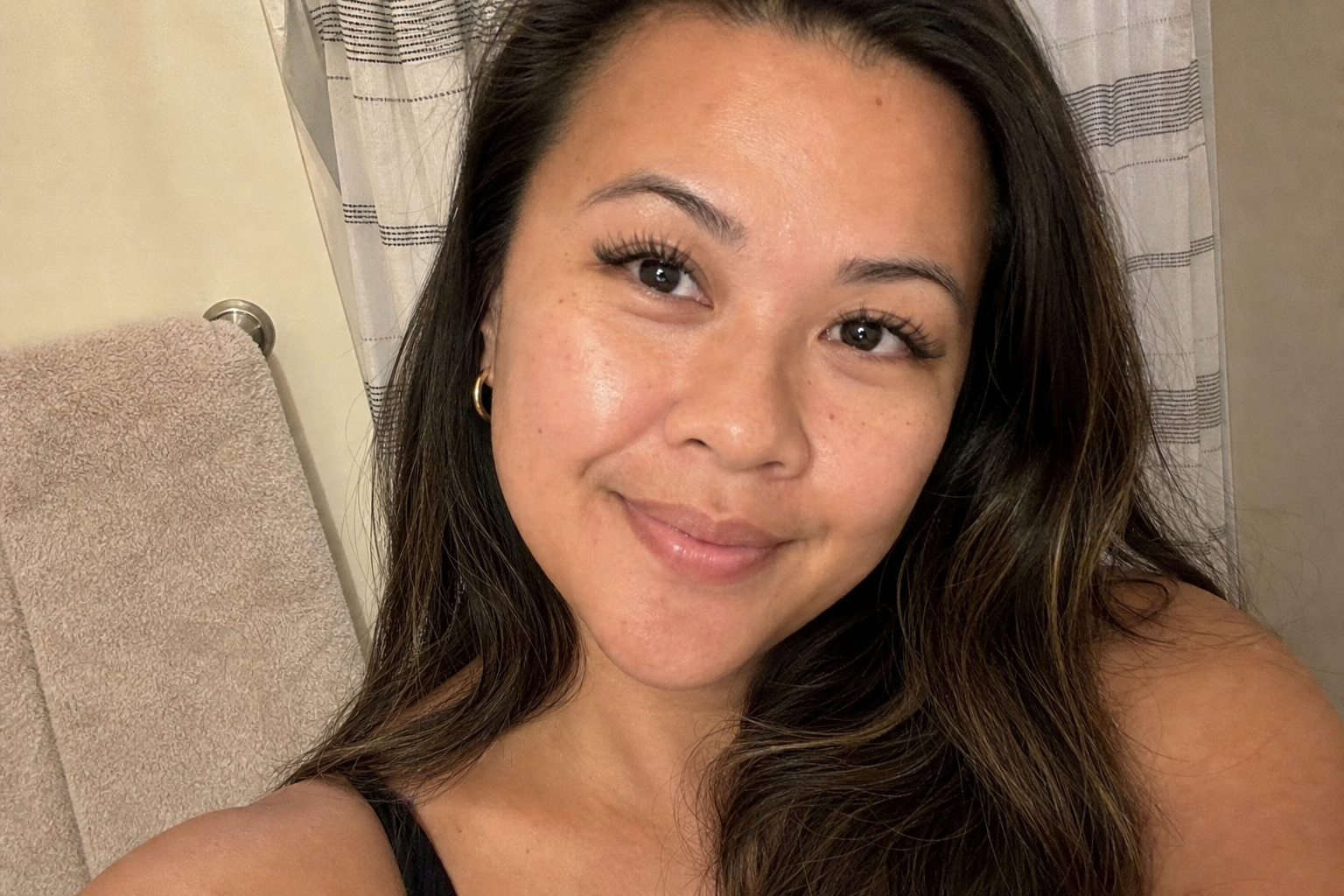 Amateur selfie of Ari showing fresh lash extensions